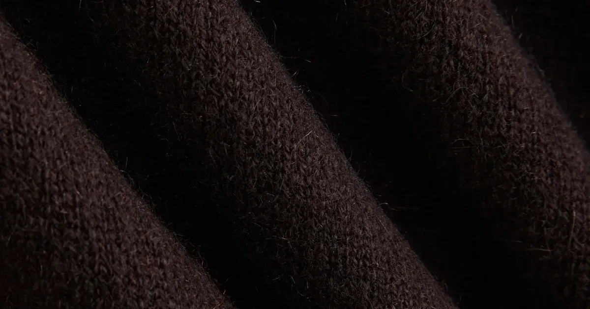 Knit fabric close-up from an official fashion storefront