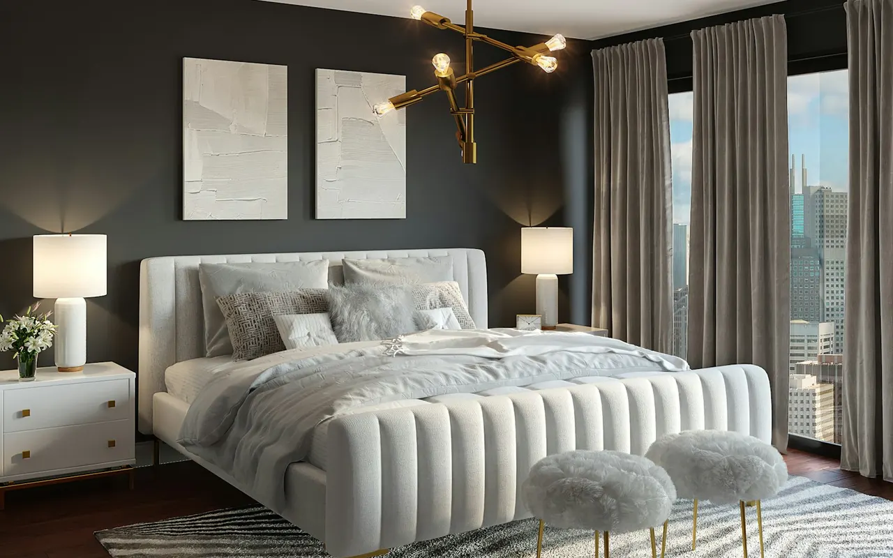 Made bed with white bedding in a city apartment bedroom