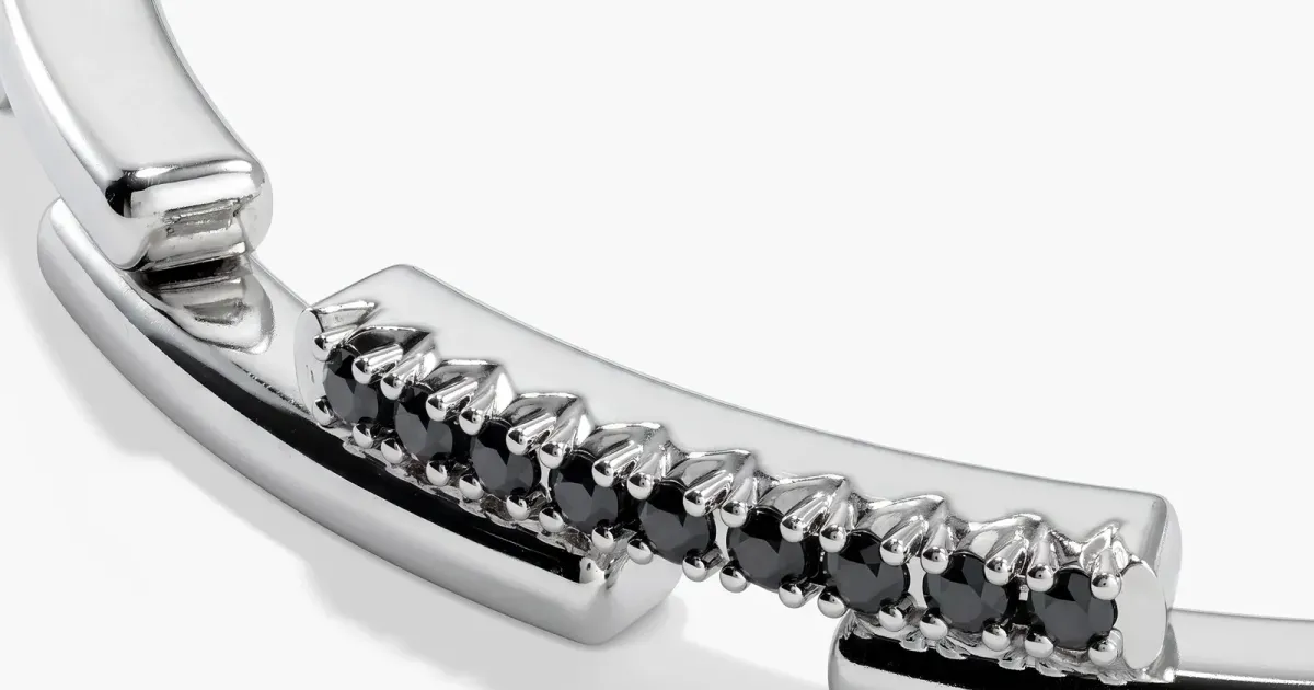 Pavé stone cuff photographed on white — official jewelry still