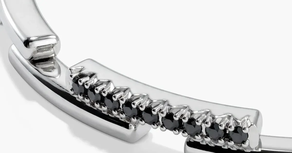 Pavé stone cuff photographed on white — official jewelry still