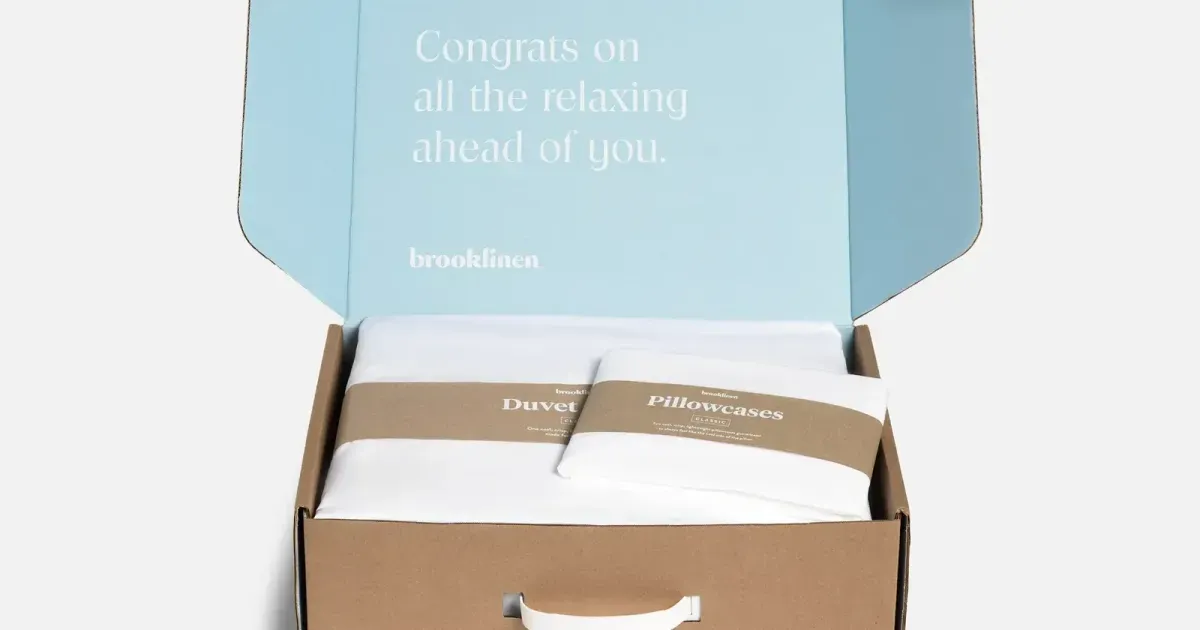 Folded bedding in a brand shipping box — the parcel a duty line is written for
