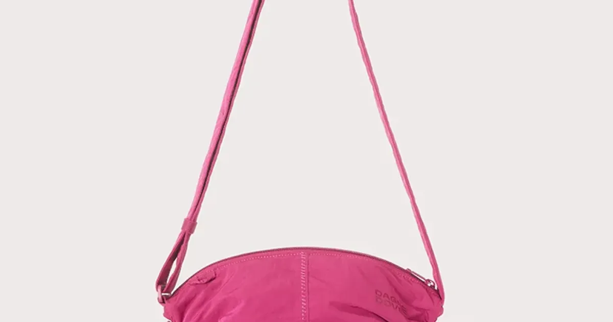 Pink crossbody bag on a pale field — the parcel a locale shipping table describes